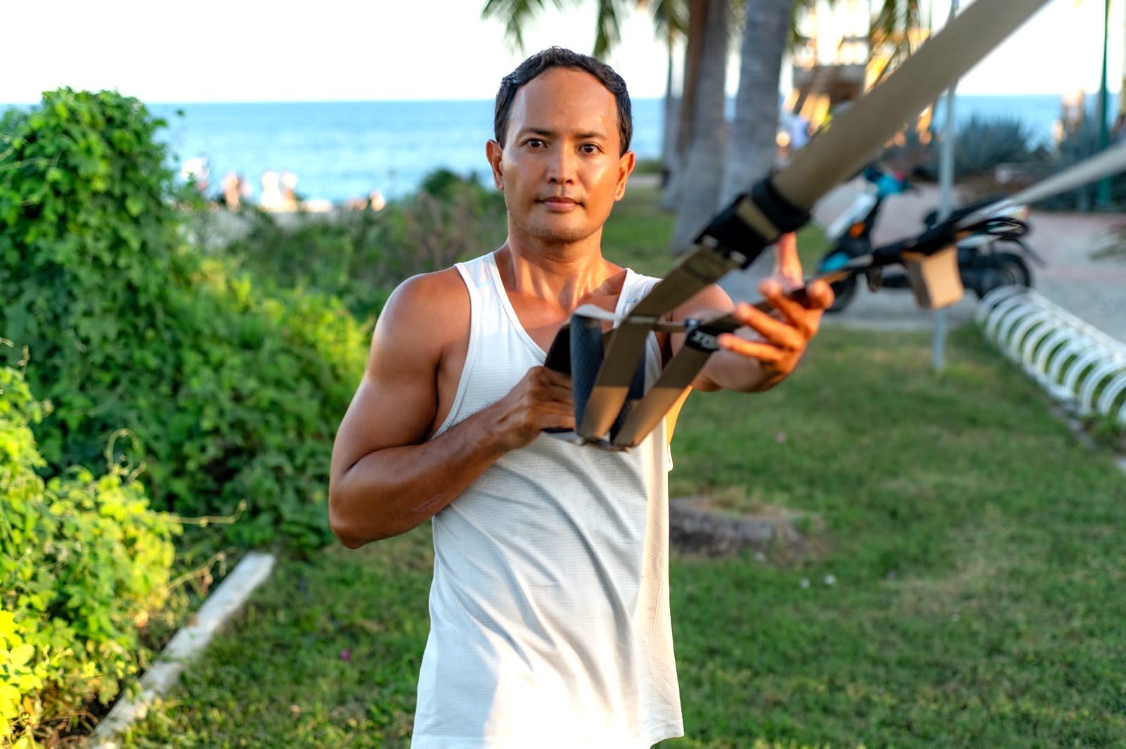 Therapeutic Movement coach Rey Carroll demonstrating TRX work